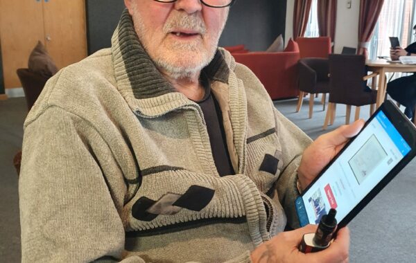 Bob using his tablet to access online auctions