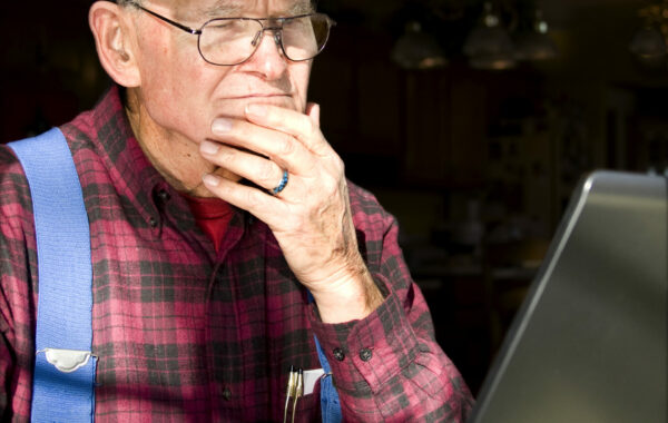 Man sat using tablet
