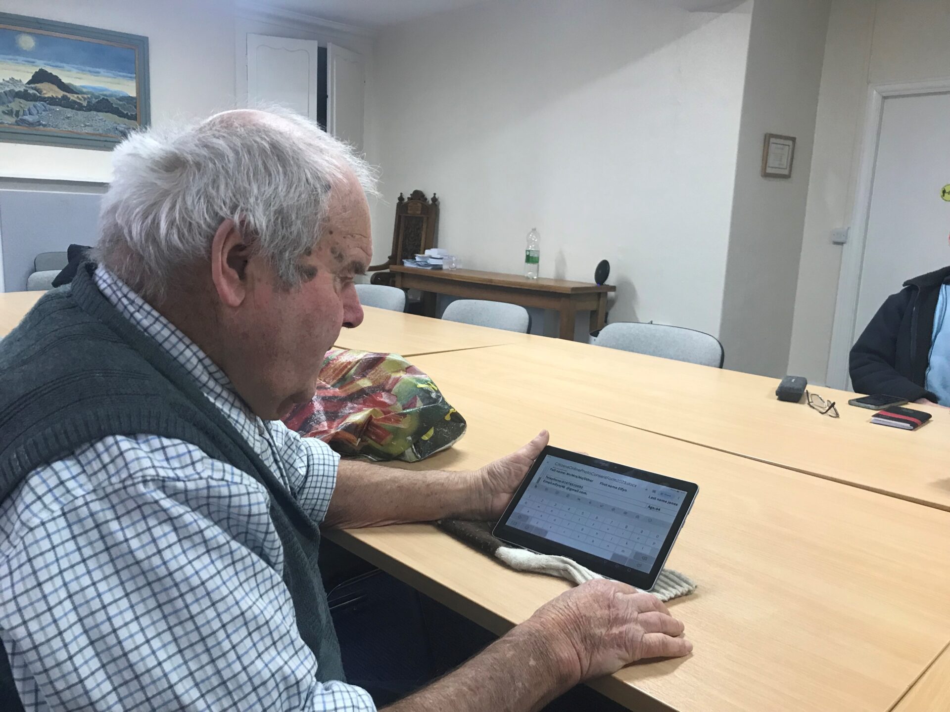 84 year old Mr Jones, using a tablet